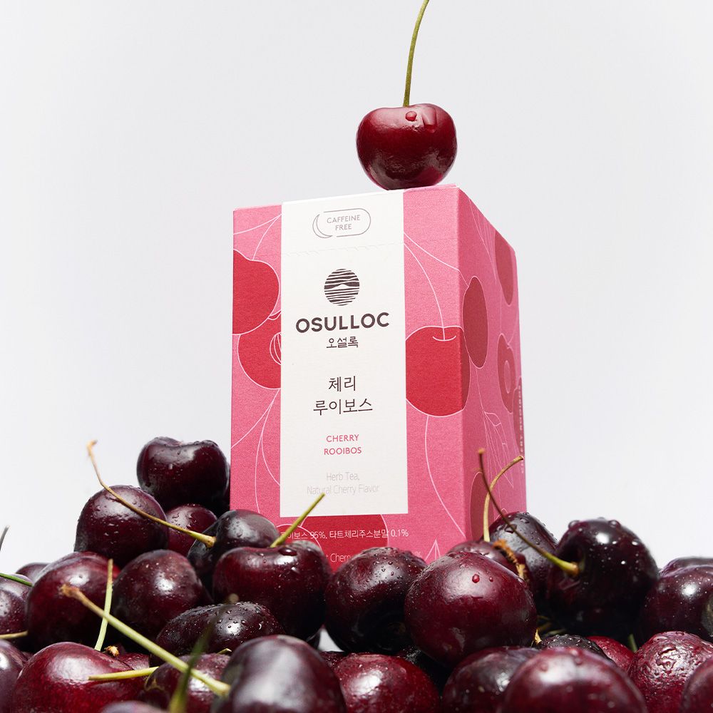 Boîte rose OSULLOC Cherry Rooibos avec des cerises fraîches 