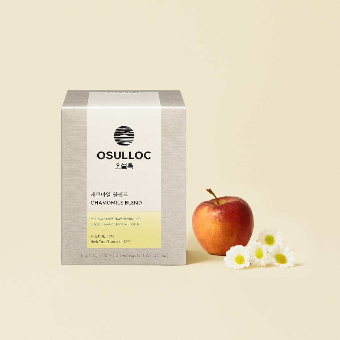 Boîte de Chamomile Blend OSULLOC avec une pomme rouge et des fleurs de camomille sur fond jaune.