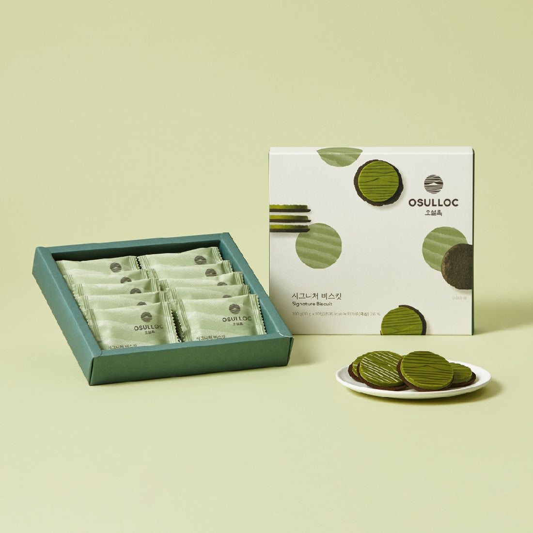 Boîte blanche OSULLOC Signature Biscuits avec des visuels de biscuits ronds vert foncé 