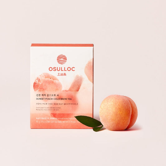 Boîte de thé Sunset Peach Cold Brew OSULLOC avec une pêche fraîche 
